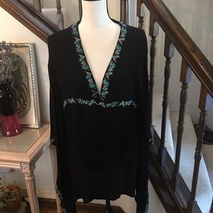 Black top with lovely flower embroidered trim.